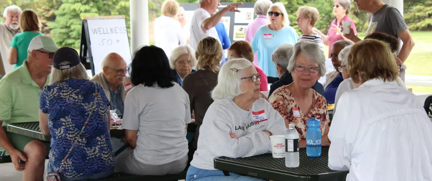 Woodbury Thrives neighbors gathered outdoors at a community wellness event